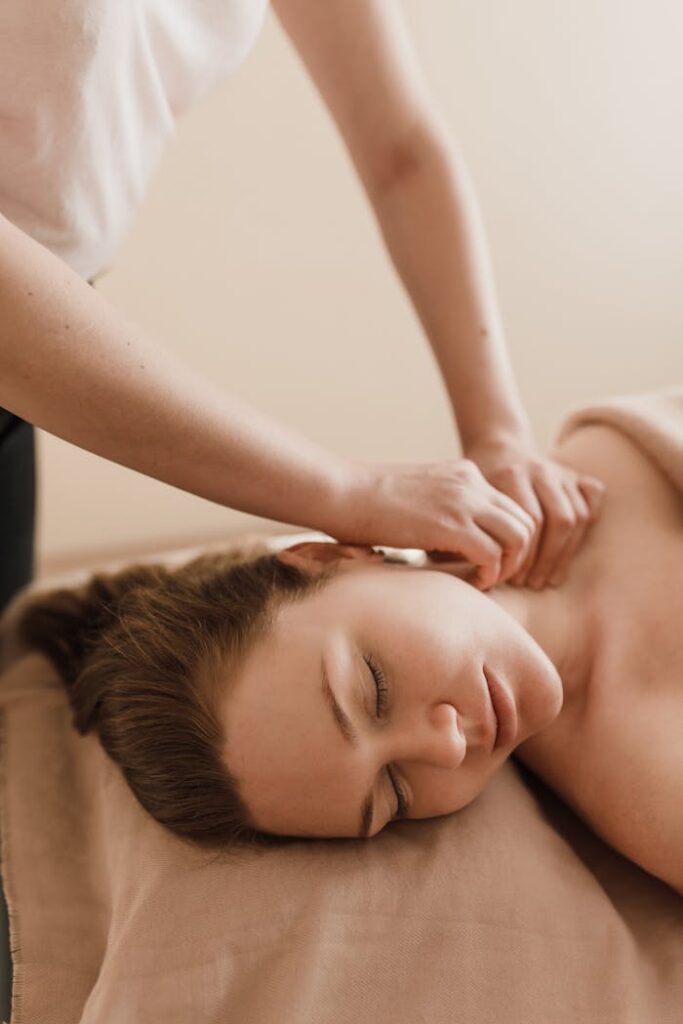 Woman enjoying a soothing massage in a serene spa setting. Ultimate relaxation.